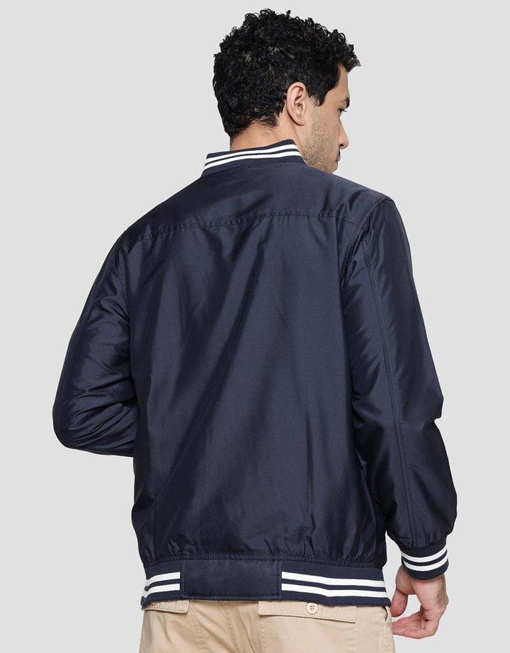 Nevada Outline Champion Print Jaket Woven Varsity Pria