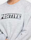 POSITIVE EMB SWEATER